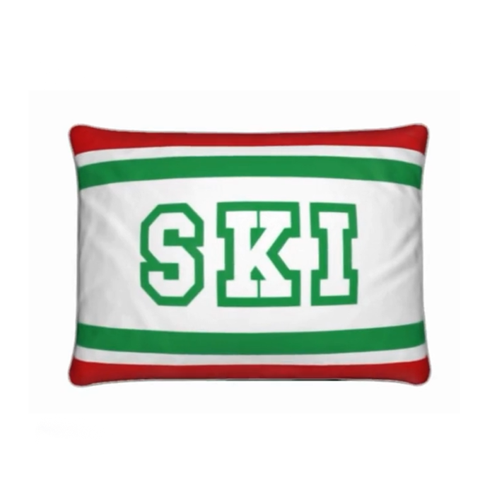 Coussin Chalet rouge, blanc et vert sur le thème du ski italien 