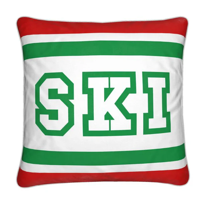 Coussin Chalet rouge, blanc et vert sur le thème du ski italien 