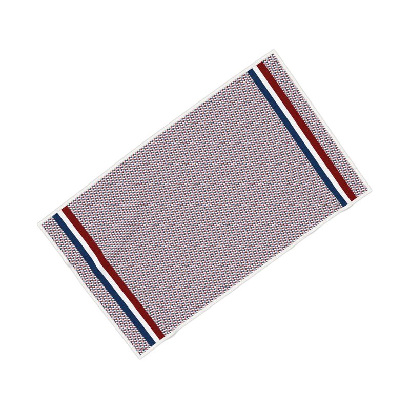 Bath towel with red and blue ski boots arranged in a modified hounds-tooth pattern.