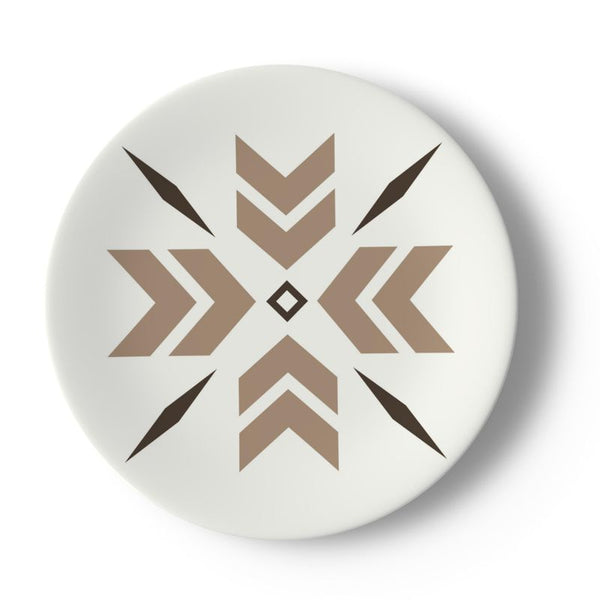 white plate with beige and brown snowflake