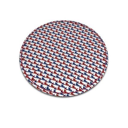 A round leather coaster with red and blue ski boot pattern that's similar to a traditional houndstooth pattern.
