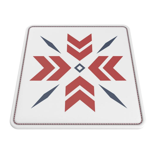 A square white leather coaster with red and blue snowflake design.