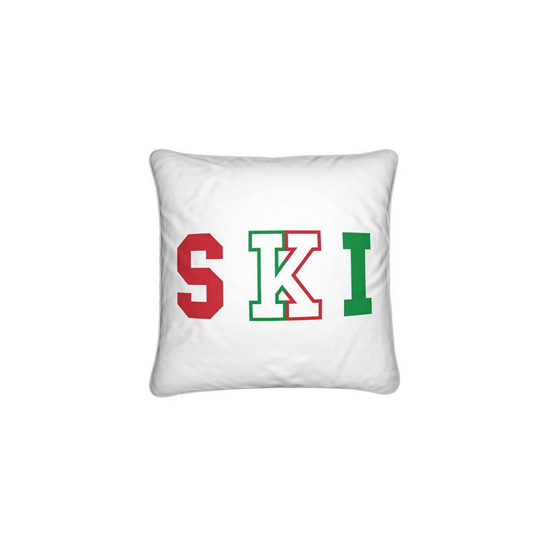 White cushion with SKI written in red and green