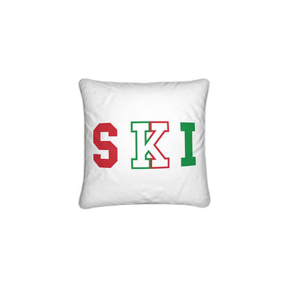 White cushion with SKI written in red and green