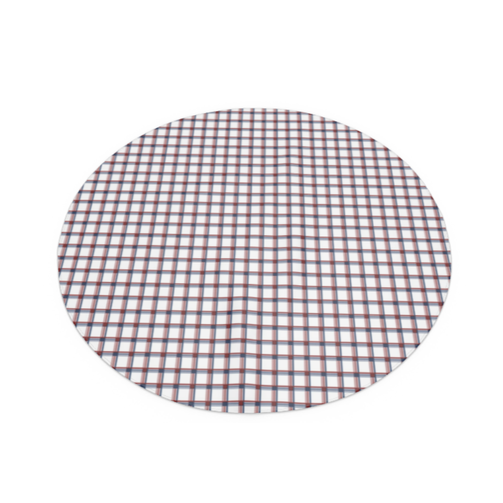 round red, white and blue checkered tablecloth laid out on a flat surface