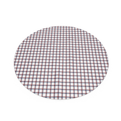round red, white and blue checkered tablecloth laid out on a flat surface